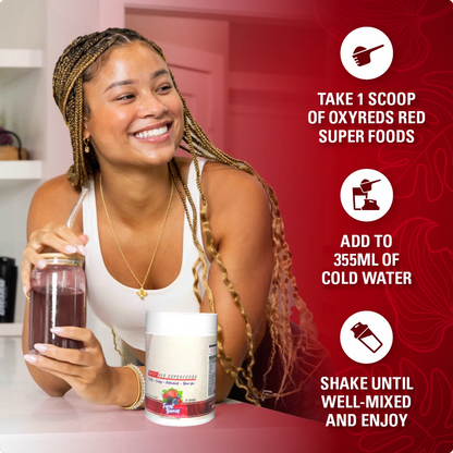 Red Superfood Powder Mixing red powder in a glass of water
